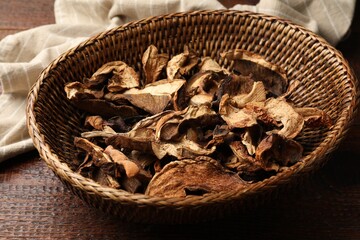Dried chanterelle mushrooms on wooden table, closeup