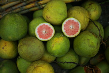 Fresh Green Pomelo Fruits With Juicy Pink Centers Displayed. west bengal 16-9-2018