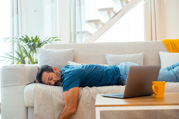 Exhausted adult man at home feeling physical pain and mental fatigue – Real moment of stress,...