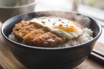 a close up of katsudon  pork cutlet and egg bowl