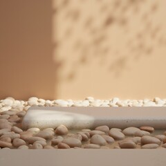 Product presentation template. A close-up shot of a pile of pebbles in front of a wall.