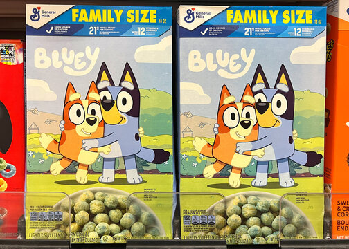 Alameda, CA - June 19, 2025: Grocery store shelf with General Mills brand cereal, Bluey. Family sized boxes.