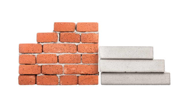 A stacked arrangement of red bricks on the left and white concrete slabs on the right, showing contrasting building materials.