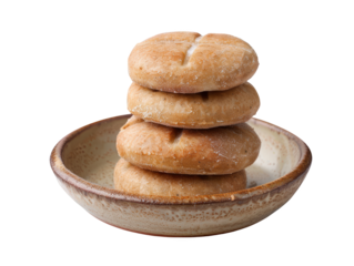 A stack of traditional round soul cakes with cross marks on top, slightly golden baked