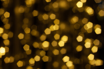 pentacle shaped bokeh, yellow on dark brown background