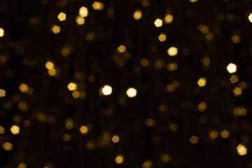pentacle shaped bokeh, yellow on dark brown background