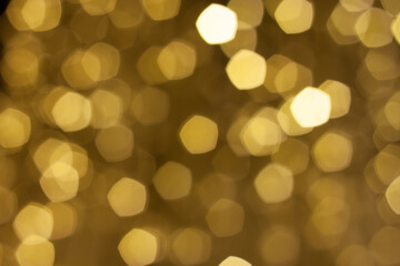 pentacle shaped bokeh, yellow and golden on brown background