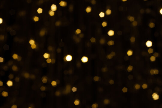 pentacle shaped bokeh, yellow on dark brown background