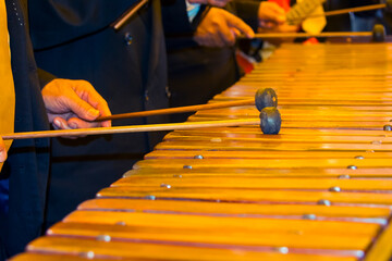 Musicians playing a handcrafted marimba made of hormigo wood, Guatemala’s national instrument....