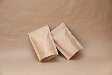 Zipper stand-up pouches on kraft paper background. Mockup for design
