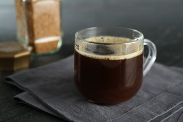 Aromatic instant coffee on black table, closeup