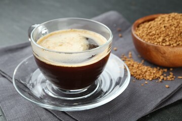 Aromatic instant coffee on black table, closeup