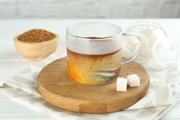 Aromatic instant coffee with sugar on table, closeup