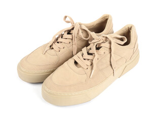 Pair of stylish beige sneakers on white background