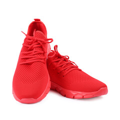 Pair of stylish red sneakers on white background