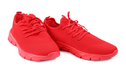 Pair of stylish red sneakers on white background