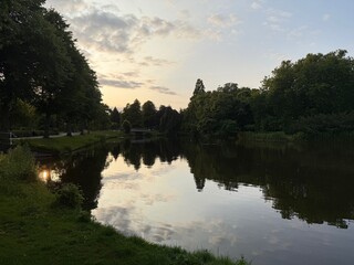 Picturesque view of canal and trees at evening outdoors