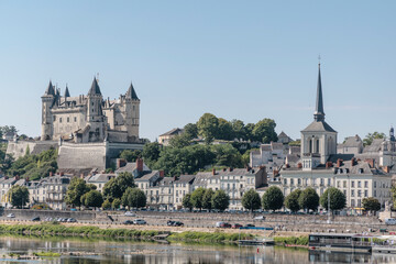 Obraz premium Peaceful Cityscape of Saumur, Beautiful Historic Town in the Loire Valley, France, Wallpaper