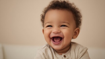 The joyful baby with an infectious smile and curly hair.