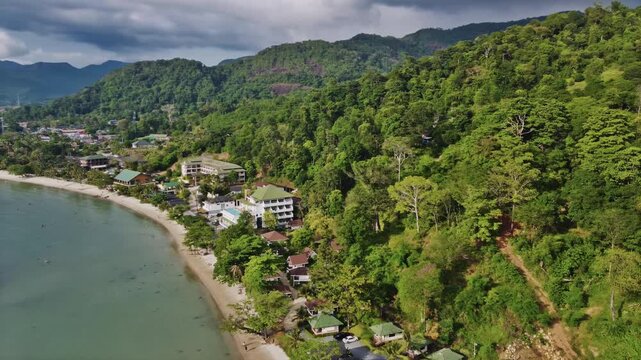 Drone view of amazing Kai Bae beach blending with turquoise waters, palm trees