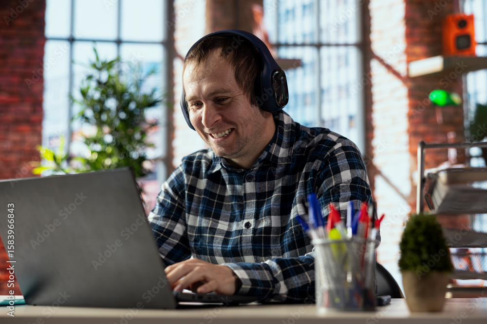 Poster man in workspace watching funny videos on social media using laptop. person using social network web