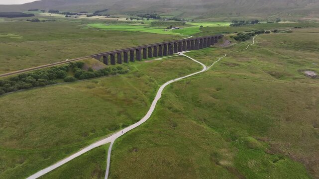Aerial Video of Ribblehead Viaduct. Viaduct carries the Settle&ndash;Carlisle railway across Batty Moss in the Ribble Valley at Ribblehead, in North Yorkshire, England