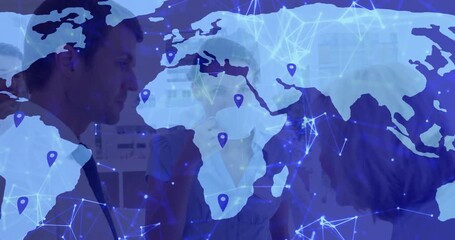 Business team discussing over mugs, overlaying map fading into network visualizing global reach - Powered by Adobe