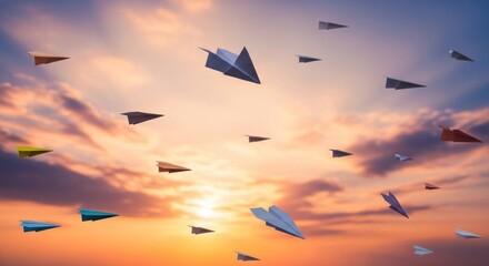 Colorful paper airplanes soar against a vibrant sunset sky, symbolizing dreams, aspirations, and freedom.