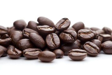 Close-up of espresso beans piled on bright white background