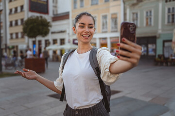 woman shows the environment with friends on a video call on cellphone