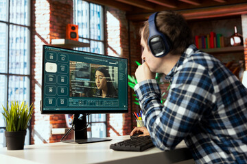 Graphic editor at workstation arranging interface elements in PC software, positioning buttons,...
