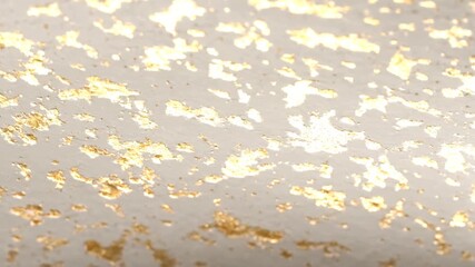 Luxury close-up of a textured white surface with shimmering gold leaf details moving under soft light - Powered by Adobe