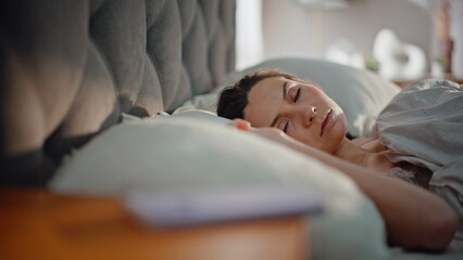 Overslept woman looking cellphone jumping from bed feeling stress closeup. 