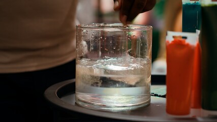 African american artist applying acrylic dye with his paintbrush on canvas, showing his skill in creating a masterpiece for the art gallery. Working with professional supplies. Camera A.