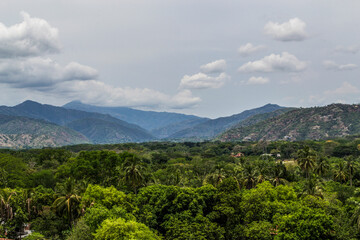 mountain landscape with trees and clouds