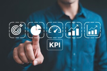 Businessman s finger touching a digital interface displaying key performance indicators and business growth icons on a dark background