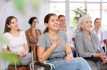 Portrait of positive cheerful female students at a lecture at the university