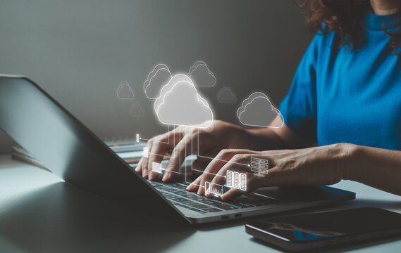 Businesswoman working on laptop with cloud computing system technology, secure data transfer, online storage, network infrastructure, digital platform solution, cybersecurity, remote work, file share.