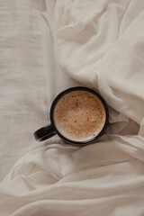 Flat Lay of Coffee Cup on Linen