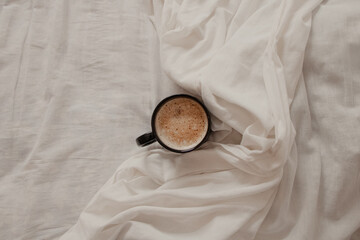 Cappuccino Mug on White Bedding