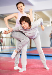 Self defense training - women practice doing painful holds