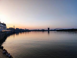 Peaceful Summer Sunset with People on Poshtova Square Waterfront in Kyiv, Ukraine

