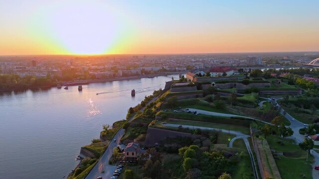 Explore the stunning sunset over Novi Sad from the Petrovaradin Fortress with breathtaking views of the city and river