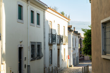 Walking through the quaint streets of Cascais, Portugal reveals beautifully preserved white...