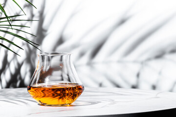 Exquisite Japanese single malt whiskey served in elegant glass, showcasing rich amber tones against...