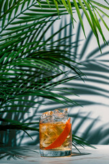Crafting a refreshing cocktail with vodka aquavit, Italian aperitif, and scotch whiskey served with...