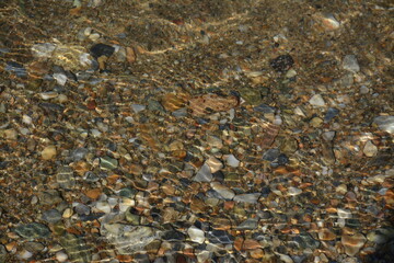 Beautiful sea rocks and sun rays in the water. Background