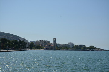 View of the city tower, embankment and sea. Volos, Greece