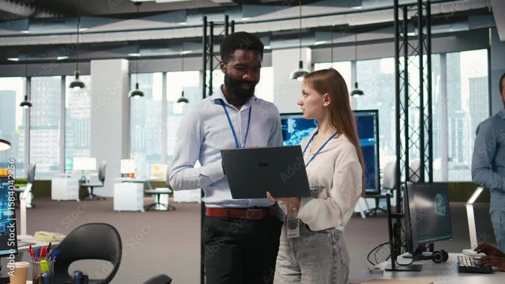 Poster female engineer and coworker coding ai algorithms to debug software issues and improving system stab