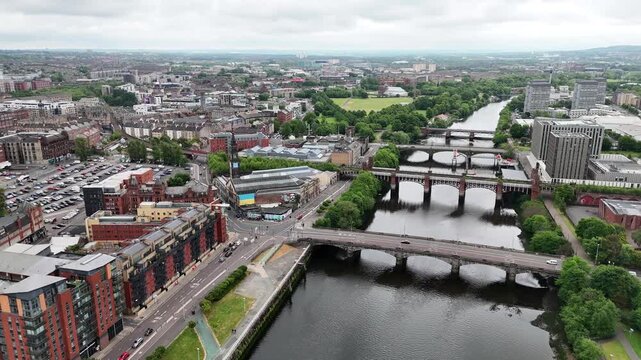 Drone shot of bridges over River Clyde near Glasgow Green Park, Scotland, UK